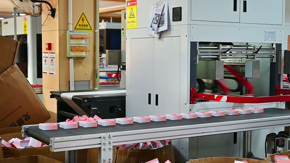 Boxes and packaging equipment shown near the end of the tour.
